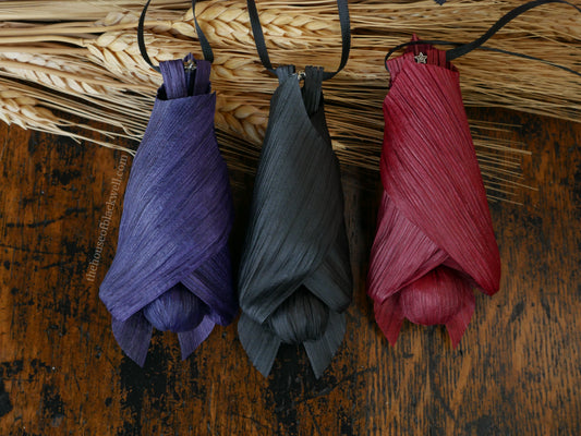 Baby bat trio corn husk dolls, Red, black, and purple